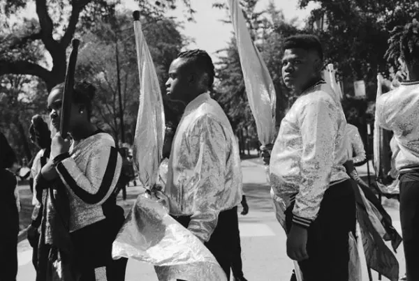 Black-and-white photograph of South Shore Drill Team members holding flags.