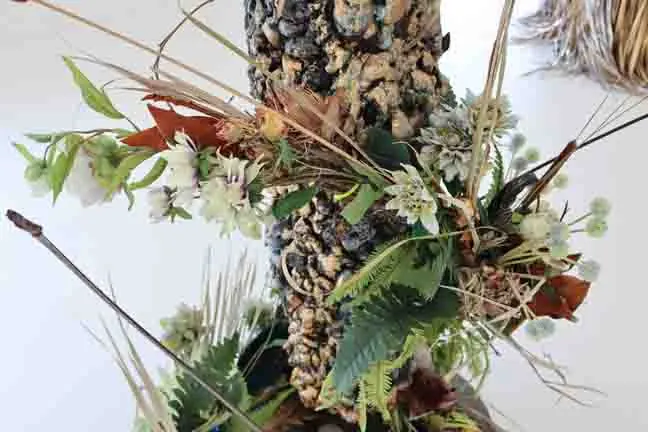 Detail from litany: a sculpture of dried flowers, grasses and found objects.